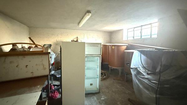 Abitazione bifamiliare con giardino vicino al centro